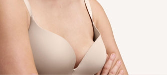 Woman wearing bra that is gaping at the top.