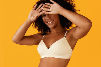 A woman modeling ThirdLove's Pima Cotton Wireless bra in white.