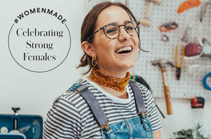 Ceramicist, Julia Ballenger, smiling in her workshop.
