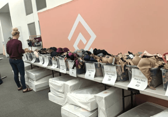 ThirdLove employee organizing bra donations for victims of the Camp Fires.