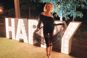 Simone Harouche wears the Tap Short in Onyx.