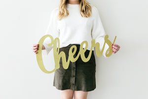 Model with a sign Cheers new years